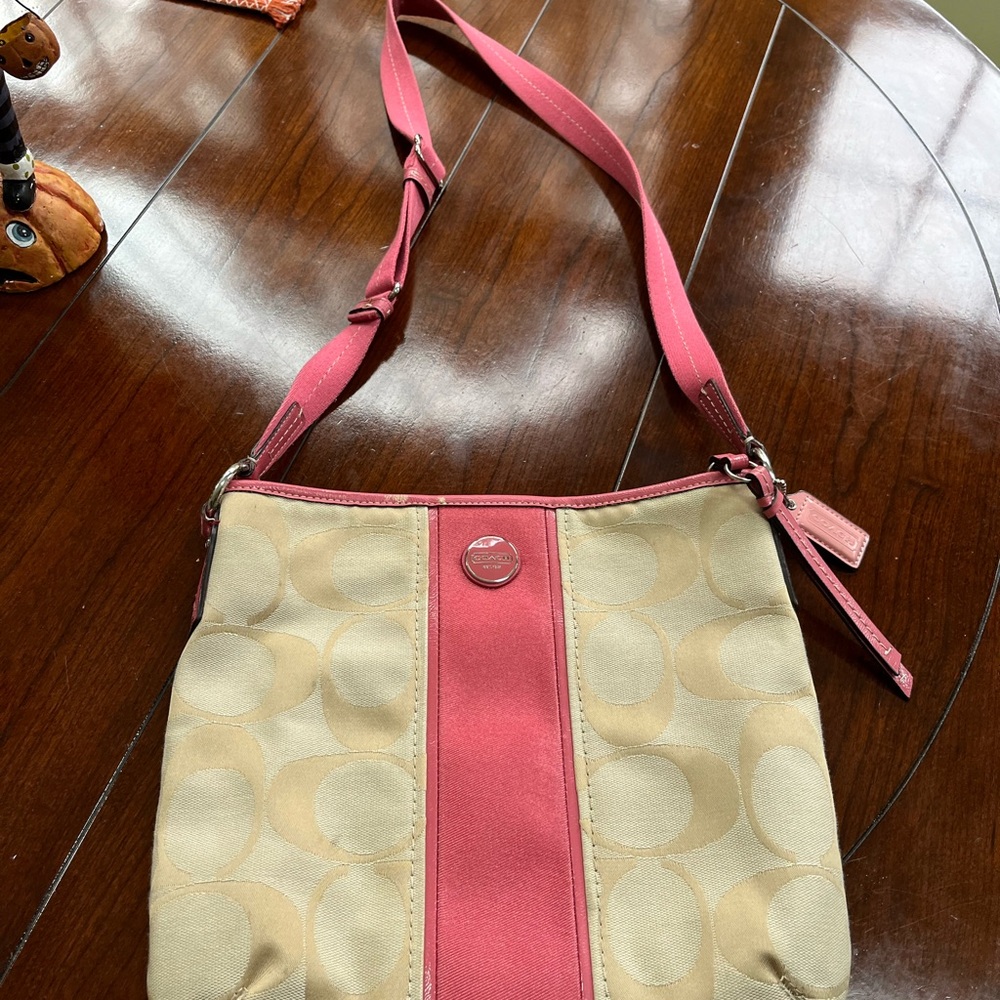 Elegant Pink and Cream Crossbody Bag Coach